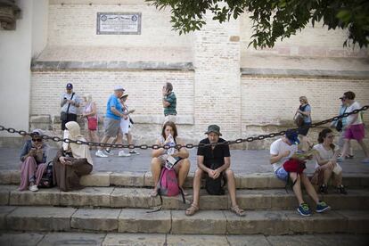 Tourists outside Seville’s cathedral.