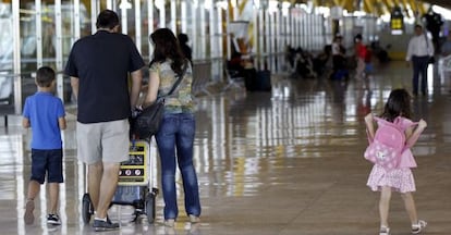 Passengers at Adolfo Suárez Madrid-Barajas Airport.