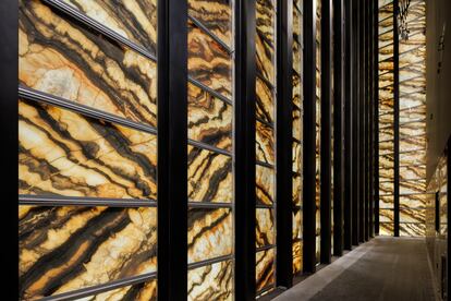 The glass-and-marble façade of PAC NYC, seen from the inside.