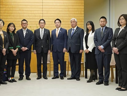 Japanese Prime Minister Fumio Kishida, center left, poses with the leaders of LGBTQ groups, as Kishida apologized to them over his former aide’s discriminatory remarks, at the prime minister's office in Tokyo, Friday, Feb. 17, 2023.