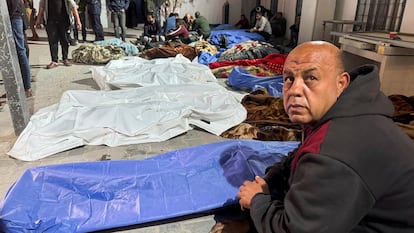 Mourners gather near the bodies of Palestinians killed in Israeli strikes, at a hospital in Gaza City March 18, 2025. 