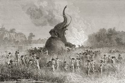 Hombres prehistóricos cazan un mamut en una ilustración de 1896.