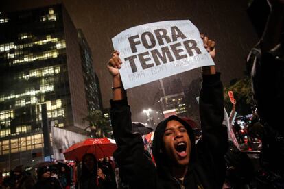 A protester makes his message clear: 'Temer out.'