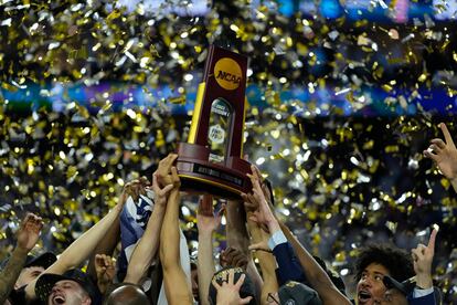 Connecticut Huskies players celebrate after defeating the San Diego State Aztecs in the national championship game of the 2023 NCAA Tournament at NRG Stadium, on April 3, 2023.