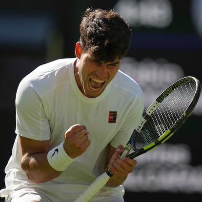 Carlos Alcaraz of Spain reacts after winning the third set against Fabio Fognini of Italy during their first round men's singles match at the Wimbledon Tennis Championships in London, Monday, June 30, 2025. (AP Photo/Alastair Grant)