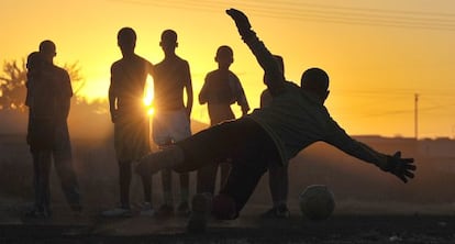 Children playing soccer in South Africa.