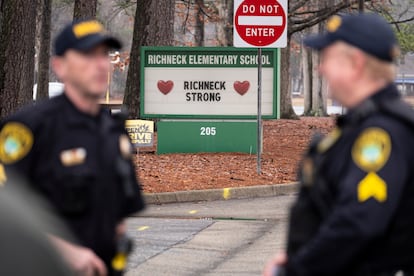 Police look on as students return to Richneck Elementary