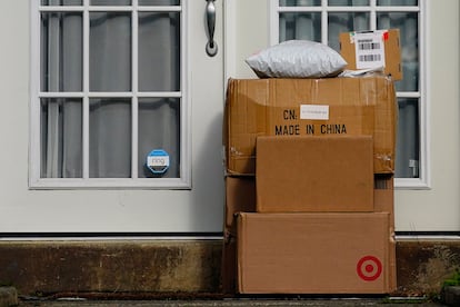 Packages are seen stacked on the doorstep of a residence, Wednesday, Oct. 27, 2021, in Upper Darby, Pa.