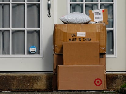 Packages are seen stacked on the doorstep of a residence, Wednesday, Oct. 27, 2021, in Upper Darby, Pa.