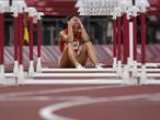 TOPSHOT - Hungary's Luca Kozak reacts after falling in the women's 100m hurdles semi-finals during the Tokyo 2020 Olympic Games at the Olympic Stadium in Tokyo on August 1, 2021. (Photo by Jewel SAMAD / AFP)