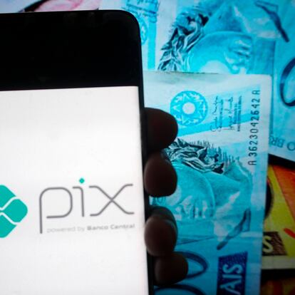 In this photo illustration a Pix logo seen displayed on a smartphone with a Pix logo in the background on September 27, 2021 in Sao Paulo, Brazil. (Photo Illustration by Cris Faga/NurPhoto via Getty Images)