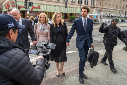 Theranos founder and CEO Elizabeth Holmes, center, walks into federal court in San Jose, Calif., Nov. 18, 2022.