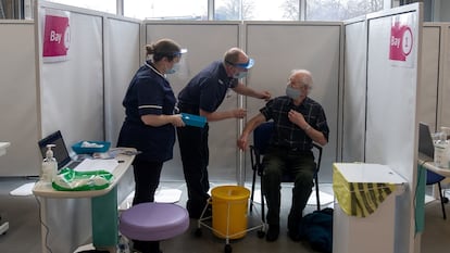 A 67-year-old man receives the Oxford-AstraZeneca vaccine in Britain.