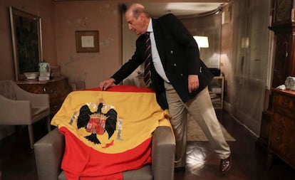 Francis Franco on Wednesday with the flag used at Franco's funeral in 1975.