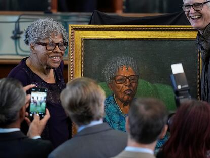 Opal Lee, left, who helped make Juneteenth a federally recognized holiday, poses with her portrait after it was unveiled in the Texas Senate Chamber, Wednesday, Feb. 8, 2023, in Austin, Texas.