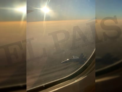 An image from inside the Air Canada plane of the F-18 fighter jet.