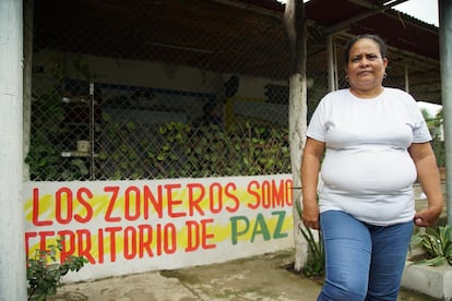 Beatriz García in front of her house in the town of Zona Bananera, in the Colombian department of Magdalena.