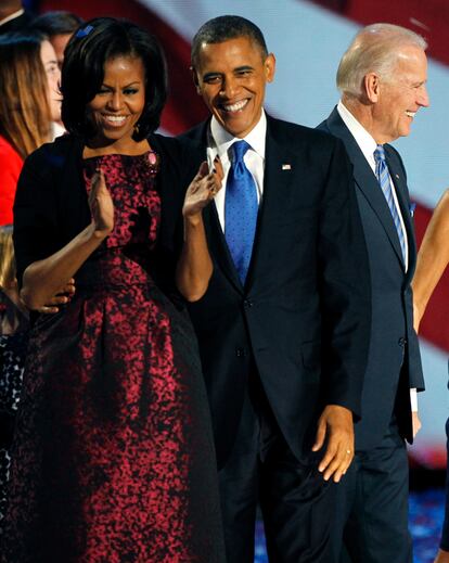 U.S. President Barack Obama stands with his wife Michelle and Vice President Biden as they face supporters following his acceptance speed during his election night victory rally in Chicago