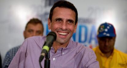 Opposition leader Henrique Capriles appears before the press after Sunday’s vote.