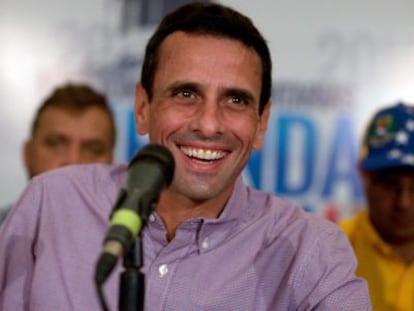 Opposition leader Henrique Capriles appears before the press after Sunday’s vote.