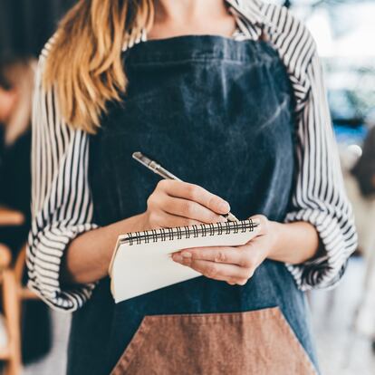 Waitress Writing On Notepad.