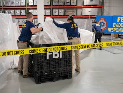 In this image provided by the FBI, FBI special agents assigned to the evidence response team process material recovered from the high altitude balloon recovered off the coast of South Carolina, Feb. 9, 2023.