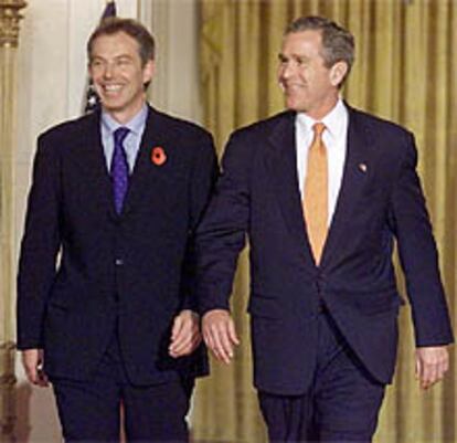 Tony Blair y George Bush, al término de su encuentro en Washington.