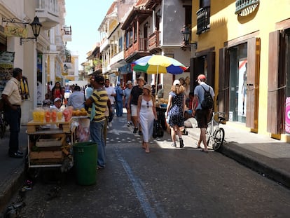 Tourists stroll the streets of Cartagena, Colombia.