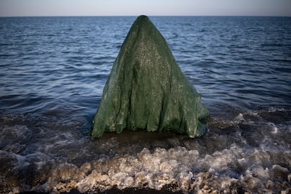 Alessandra García entering the sea of Guadalmar Beach during an essay of her performance.