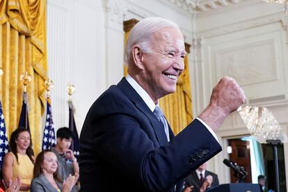 U.S. President Joe Biden gives a fist bump salute to the audience during an event to celebrate the anniversary of his signing of the 2022 Inflation Reduction Act legislation, in the East Room of the White House in Washington, U.S., August 16, 2023.