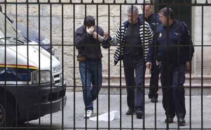 Raúl Conejero hides his face as he arrives at court in Alicante earlier this year.
