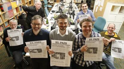 The team behind the EL PAÍS ENGLISH EDITION, pictured with the proofs of the last print issue.