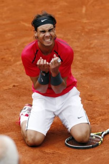 Rafael Nadal celebrates after winning the French Open final in four sets against  Novak Djokovic.