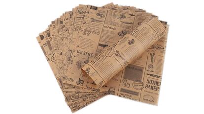 Este original pack de 100 hojas de papel encerado y decorado con motivos periodísticos es apto para envolver todo tipo de alimentos.