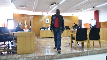 Adou's father at the courthouse.