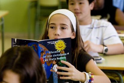 Language learning for lifetimes... Twelve-year-olds follow a citizenship class in Poble Nou public primary school, Barcelona province.