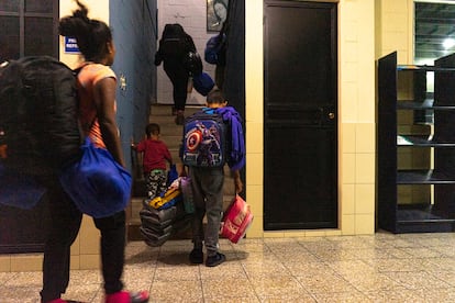 Venezuelan migrants go up to the second floor of the Casa del Migrante, where the dormitories are located. 