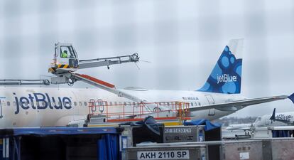 A Jet Blue aircraft is prepared for de-icing at Logan International Airport in Boston, Massachusetts, USA, 28 February 2023.