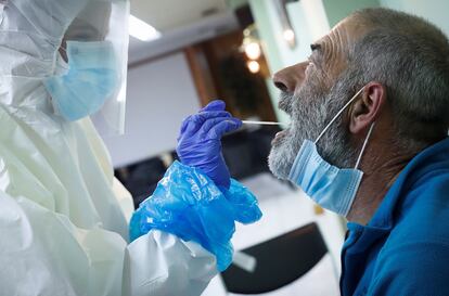 A health worker tests a fisherman for coronavirus in Spain’s Basque Country. 