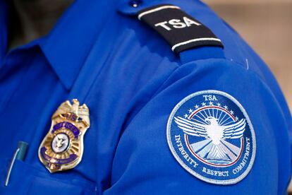 A Transportation Security Administration officer works at Dallas Love Field Airport on June 24, 2020, in Dallas