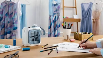 Artículo de EL PAÍS Escaparate que describe las ventajas de usar un calefactor cerámico de bajo consumo para la oficina.