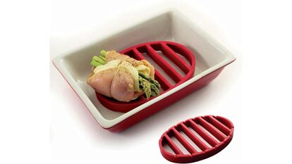 Esta rejilla roja de silicona para asar es apta para ollas de cocción lenta, ollas rápidas y cocina al vapor.