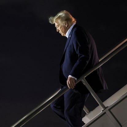 U.S. President Donald Trump deboards the plane as he arrives at Miami International Airport in Miami, Florida, U.S., January 25, 2025. REUTERS/Leah Millis