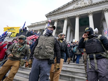 Members of the Oath Keepers extremist group stand on the East Front of the U.S. Capitol on Jan. 6, 2021, in Washington.