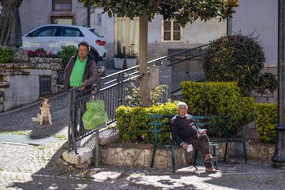 Enrico "Dragon" Ferrante and Giovanni Petrucci (seated) in Castellino's town square.