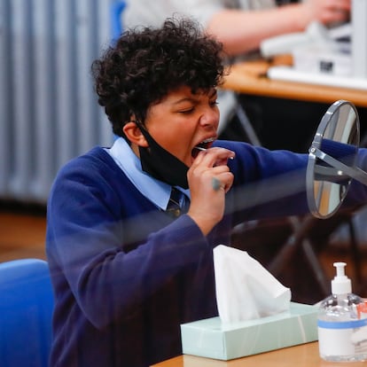 A student takes a lateral flow test at Weaverham High School, as the coronavirus disease (COVID-19) lockdown begins to ease, in Cheshire, Britain, March 9, 2021. REUTERS/Jason Cairnduff