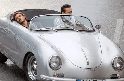 Pedro Pascal sleeping in the Porsche, next to Nicolas Cage.

