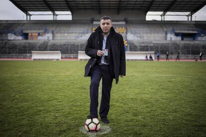 Mohamed Tria, a 50-year-old businessman and married father of four, who manages the lower-league football team AS Duchere poses with his elctoral card on January 6, 2017 on the pitch of his club's stadium in the central city of Lyon.
What should be the priorities of the next French president?
"I want the next president to introduce statistics on police brutality, in order to highlight a problem that is an important factor behind the violence in the suburbs. Because it is unconscionable that members of the security forces, who are supposed to be protecting us, could be contributing to the violence. That includes racial profiling during identity checks, which starts at 14-15 years old. I was a victim of this myself 40 years ago, which shows it's a real issue that runs deep and which youngsters in these neighbourhoods are growing up with, unfortunately." / AFP PHOTO / JEFF PACHOUD / RESTRICTED TO EDITORIAL USE - RESTRICTED TO FRENCH ELECTIONS ILLUSTRATION PURPOSE