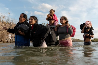 Migrants cross from Mexico to Eagle Pass, Texas