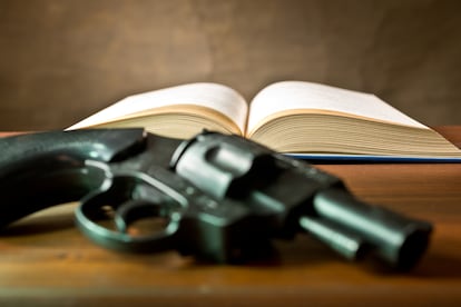 open book with handgun